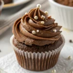 Gluten-Free Chocolate Cupcakes – The Ultimate Moist & Fluffy Recipe Guide 7 Gluten-free chocolate cupcake with smooth chocolate frosting and white pearl sprinkles