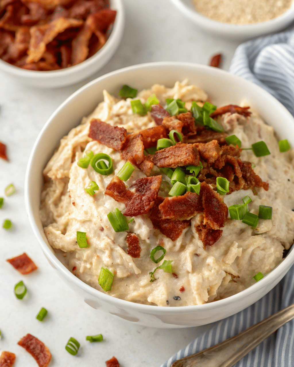 Instant Pot Crack Chicken: The Ultimate Creamy Comfort Food 2 Instant Pot Crack Chicken in a creamy sauce topped with bacon